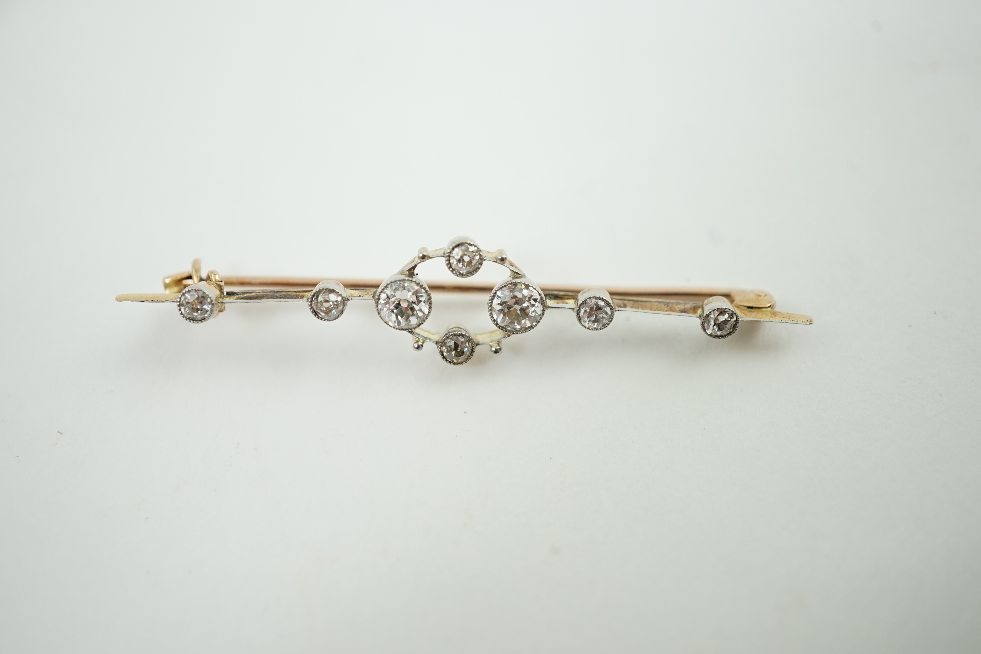 A Belle Epoque gold an diamond cluster set open work bar brooch